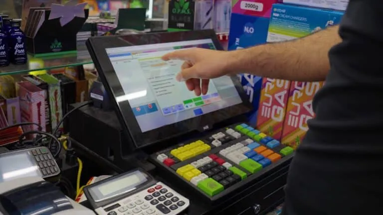 A POS360 technician setting up the 360 Pro register